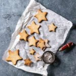 Star-shaped cookies on a piece of parchment paper