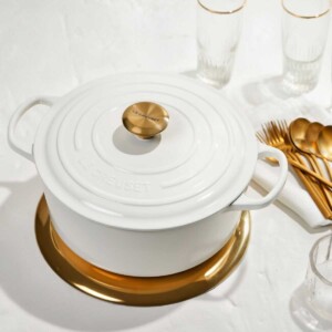 Gold knob and gold flatware.