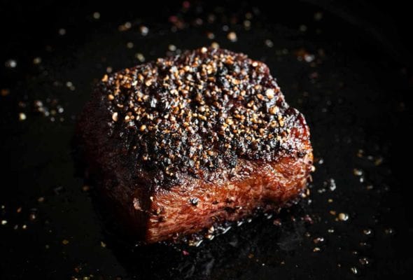 A seared steak au poivre.