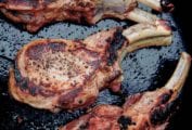 Three golden-brown pan-roasted pork chops
