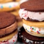 Several ice cream cookie sandwiches stacked on top of each other.