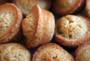 A pile of brown butter financiers baked in mini muffin molds