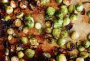 Crispy roasted Brussels sprouts on a rimmed baking sheet.