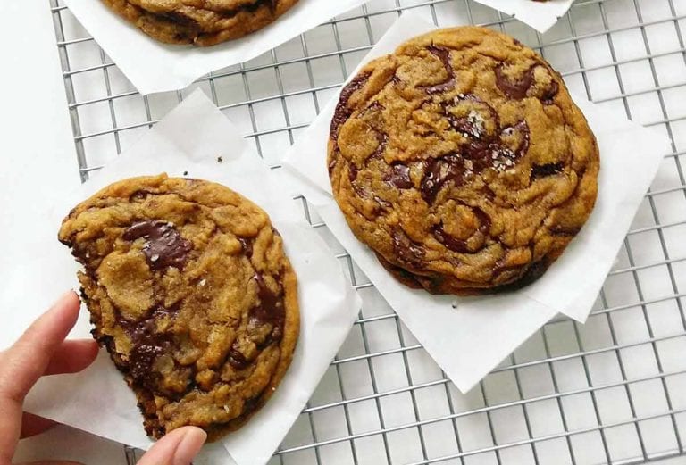 Two ultimate chocolate chip cookies, AKA New York chocolate chip cookies on a wire rack