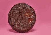 A world peace cookies, or korova cookie by Dorie Greenspan, on a pink background