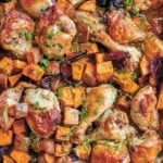 A sheet pan of Rosh Hashanah celebration chicken--roasted chicken pieces, sweet potatoes, onions, parsley
