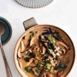 A crock filled with shiitake barley soup--mushroom, leeks, miso, ginger, scallions, nori seaweed