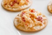 Crackers topped with pimento cheese.