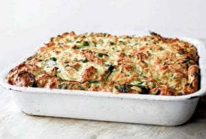 A white baking dish filled with zucchini strata