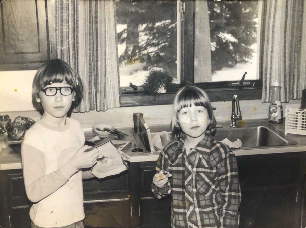 Renee and her brother captured in a childhood photo as discussed in 'Comfort Me With Doughnuts'.