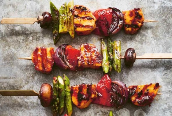 Four grilled vegetable skewers with harissa-marinated halloumi.