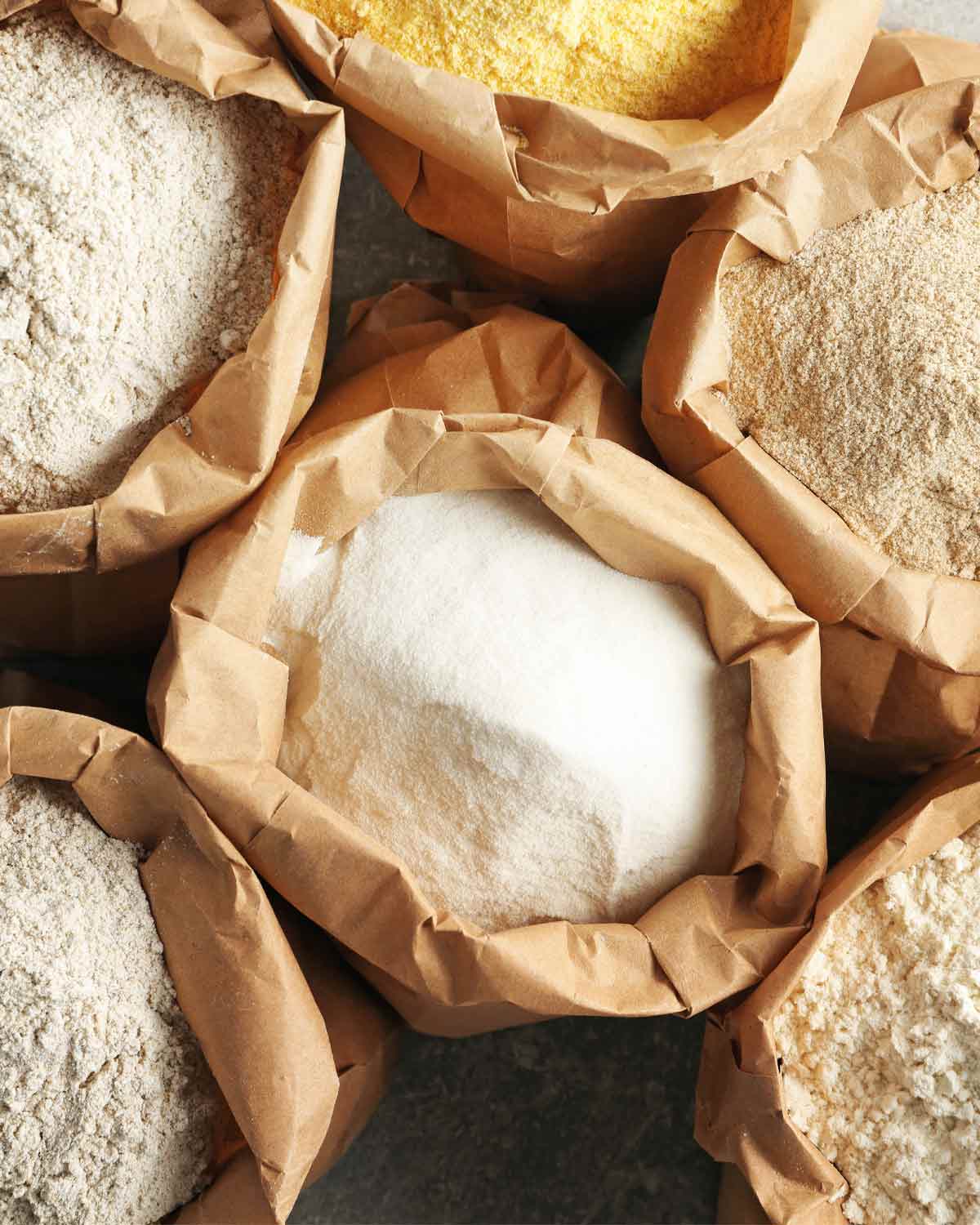 Open bags of different types of flours.