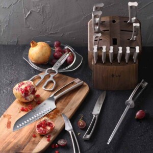 Cangshan TN1 Series 17-Piece Knife Block Set with grapes and pomegranate cut open.
