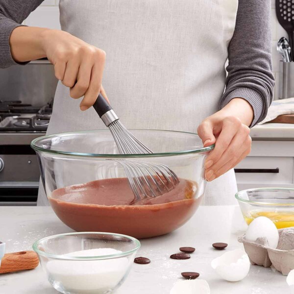 OXO Good Grips Balloon Whisk in use with chocolate pudding.