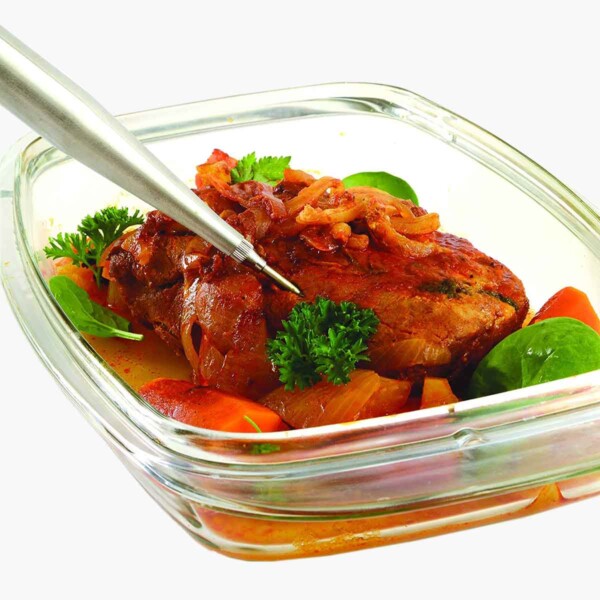 Stainless Steel Baster shown basting roast in glass container.