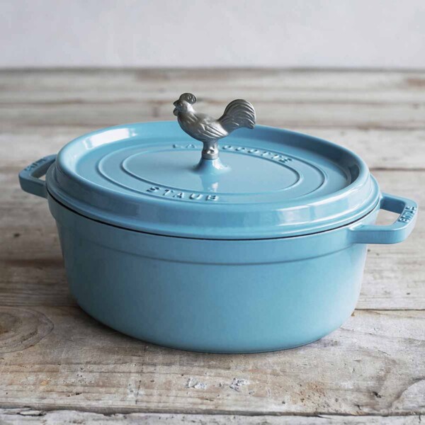 Staub Coq Au Vin Cocotte shown in blue with top on.