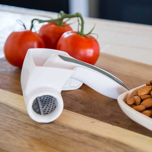 Zyliss Classic Rotary Cheese Grater with almonds and tomatoes.