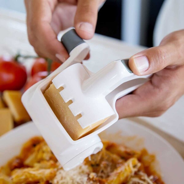 Zyliss Classic Rotary Cheese Grater in use over pasta.