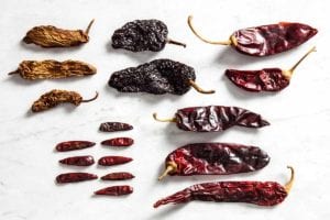 Several types of dried chile peppers to illustrate the difference among dried chile peppers.