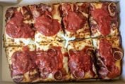 A Pizza Hut Detroit-style pizza cut into 8 squares.