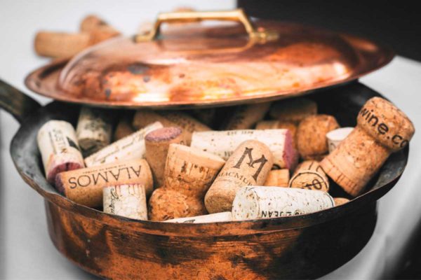 A pot filled with wine corks as illustration of 'What's the Difference Between Cooking With Red Wine Versus White Wine?'