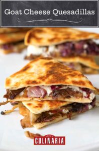 Two pieces of goat cheese quesadillas filled with radicchio, tapenade, and goat cheese stacked on top of each other.
