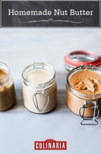 Three jars of homemade nut butter made with different nuts.