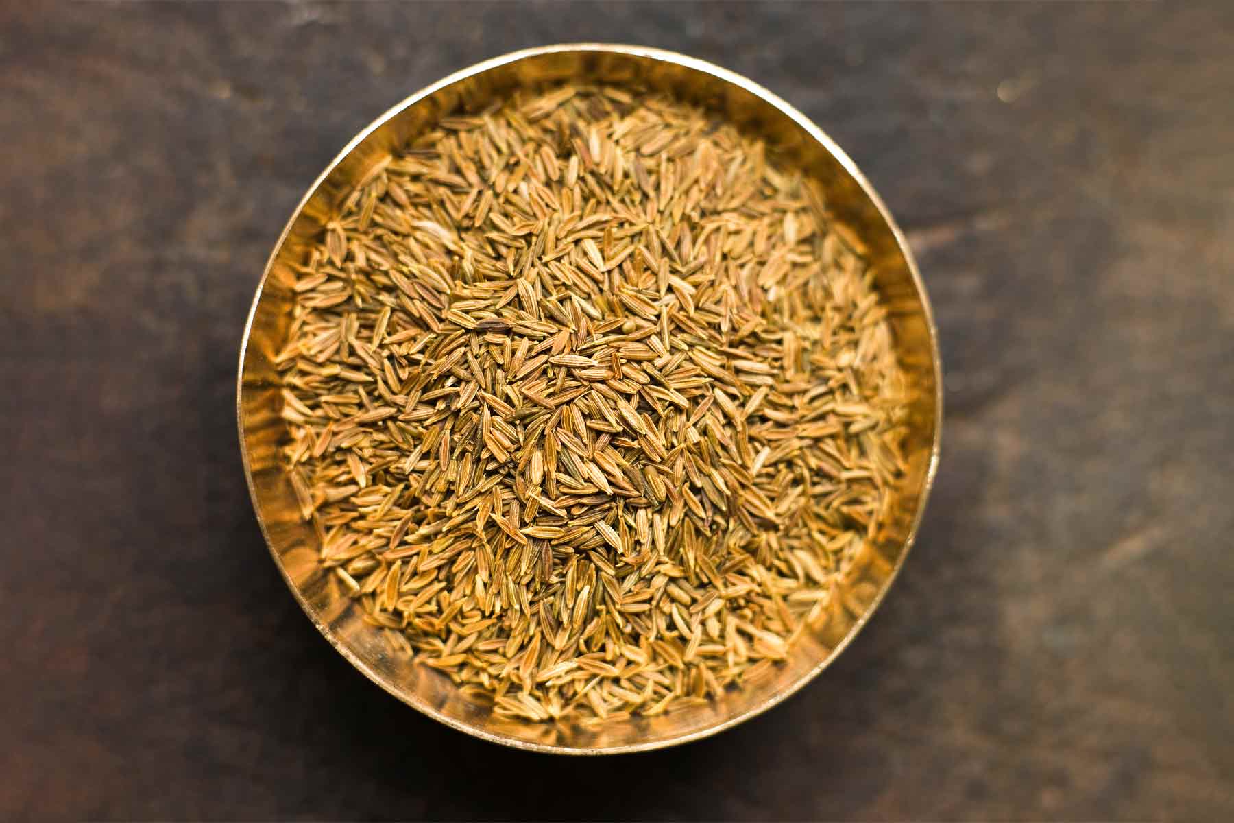 A bowl of cumin seeds.