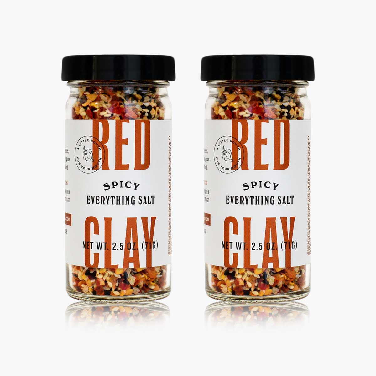 Two bottles of Red Clay Spicy Everything Salt