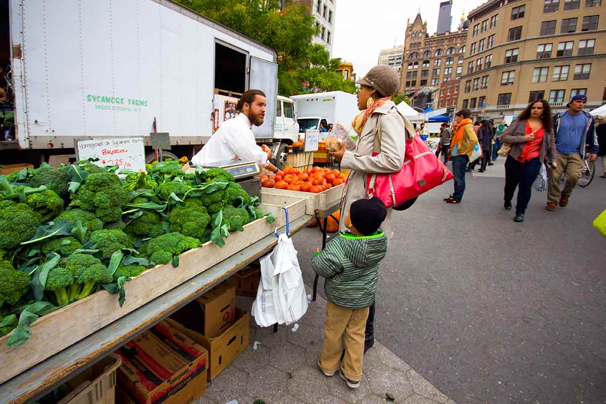 People purchasing produce at Union Square market.