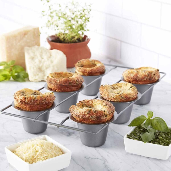 Chicago Metallic Popover Pan with cheese and herbs.