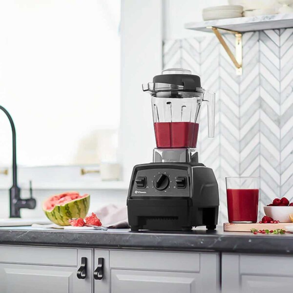 Vitamix E310 on counter with watermelon juice.
