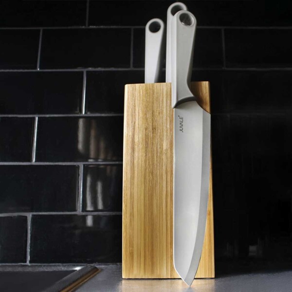 Knife Block Bamboo with Bristles with black tile background.