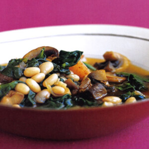 A white bowl filled with quick navy-bean stew.